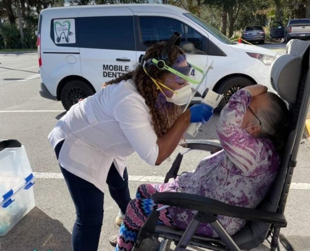 Sonya and patient receiving oral care